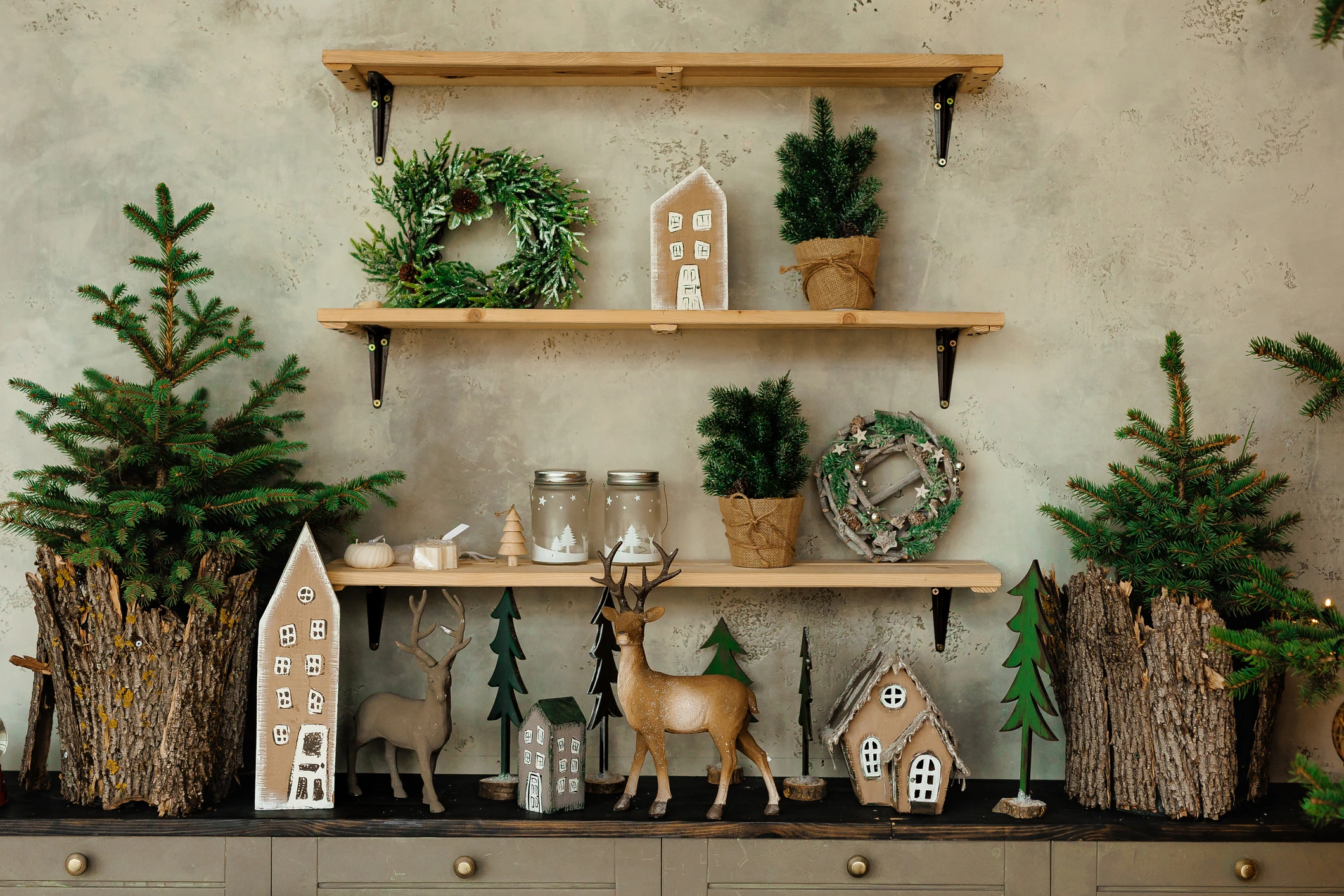 Christmas-themed shelf with decorations and wreaths.